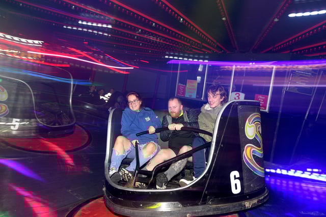 Thrill-seekers enjoying the Waltzer - a classic funfair ride.