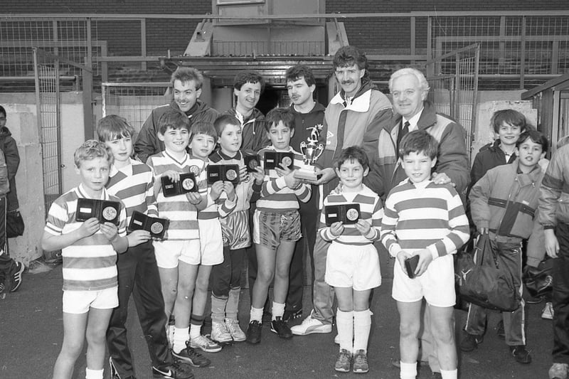 The schoolboy soccer starlets of St Gregory's are the toast of Preston. St Gregory's emerged triumphant from a spcial seven-a-side tournament featuring 16 local primrary schools, sponsored by SSS Sports and held at Deepdale. Organiser Mick Baxter is seen handing the winner's prize to St Gregory's captain Chris Borwick. Looking on, from left to right, are the winners Keith Aspinall (coach), Paul Dean, Stephen Ratcliffe, Kevin Kilbane, Tommy Kirkby, David Lucas, Andrew Collins and Michael McGowan