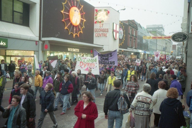 Hundreds of angry young gay men and lesbians marched through Preston town centre to protest at what they claim are county council plans to "gag" homosexuals. Around 500 gathered on the Flag Market for a rally and demonstration against new county council draft guidelines for youth and community staff working with homosexuals. Pictured above the crowds head through town