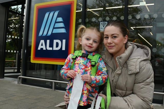 Happy shoppers Amy Waddington and Alyza, three, outside the newly opened Aldi supermarket.