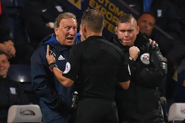 Referee Oliver Langford has words with Cardiff City's manager Neil Warnock