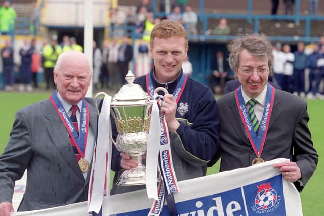 Sir Tom Finney (left) and Preston North End manager David Moyes (centre) lift the Division Two trophy