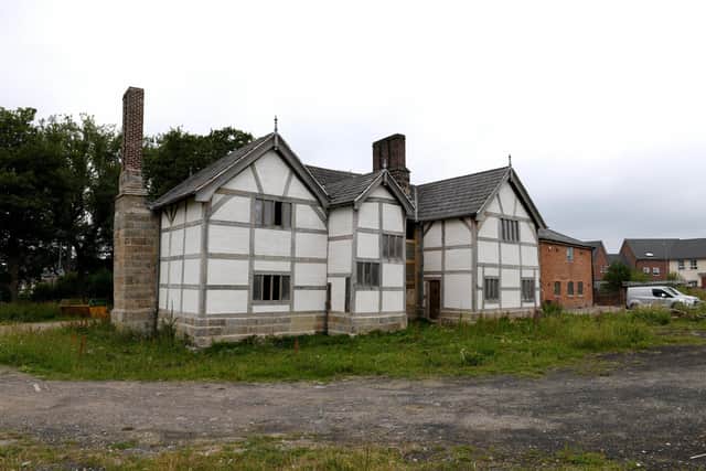 Buckshaw Hall, near Chorley. The timber-framed former manor house has been partly restored, and there are plans for four houses in the grounds to help fund future repairs, but the listed building still appears on Historic England's at-risk register.