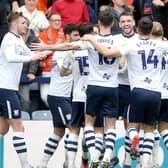 Ben Whiteman (3rd right) is mobbed by team-mates as he celebrates scoring his side's second goal from a free-kick