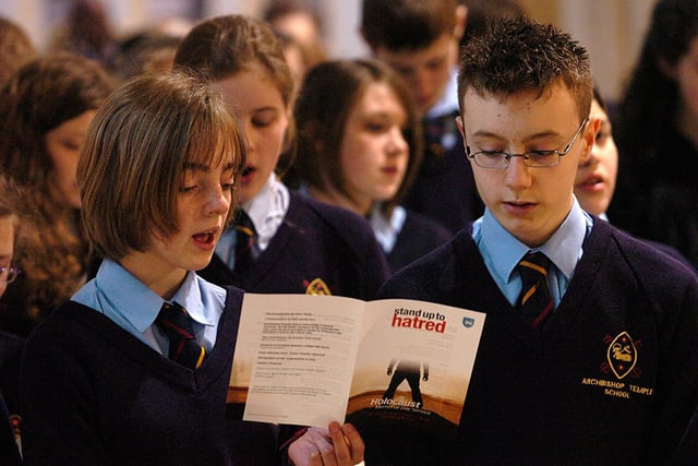 Pupils from Archbishop Temple High School sing a hymn at the Holocaust Memorial Day service held in the Minster of St John, Preston