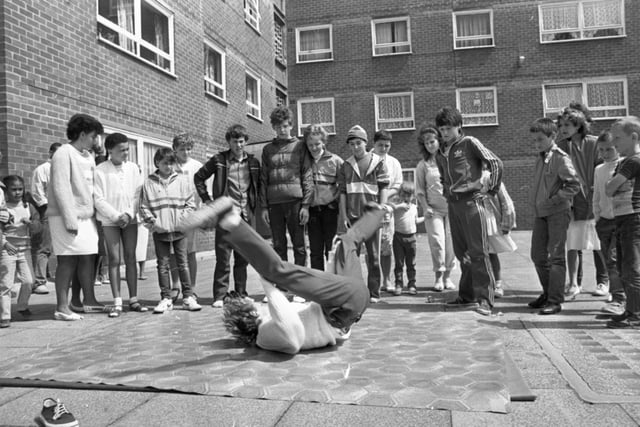 An afternoon of fun and music could mark the turning point for the residents of a strife-torn flats complex. Their summer festival may not have been as lavish or big as many Lancashire carnivals but in many ways it was more important. For the people who live in three high-rise blocks on Moor Lane, Preston, it was an important step towards creating community spirit in a place where it has been sadly lacking. Pictured: A group of lads calling themselves 'Level One' gave demonstrations of breakdancing