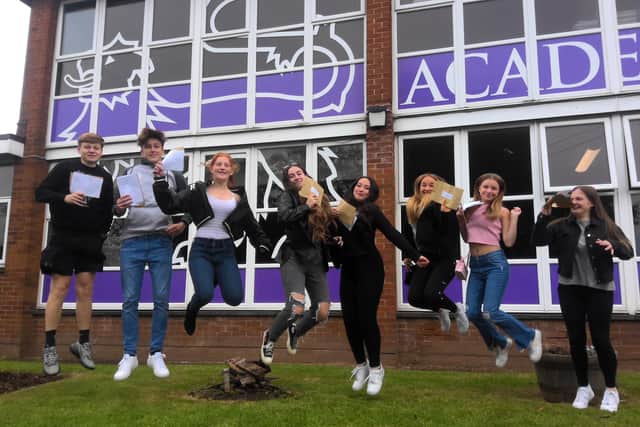 Pupils at Worden Academy celebrate receiving results which excel last year's figures.
