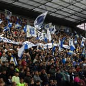 Preston North End fans wave flags against Burnley.