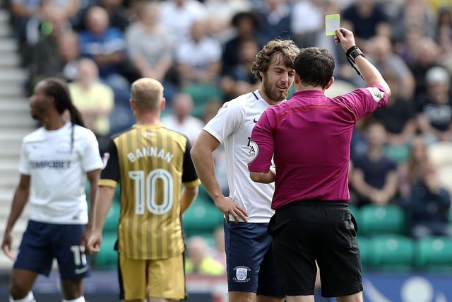 Preston North End's Ben Pearson is shown a yellow card by Referee Tony Harrington.