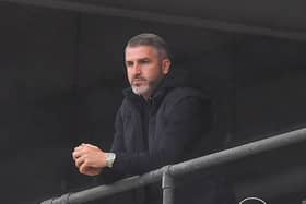 Preston North End's manager Ryan Lowe watches the game from above