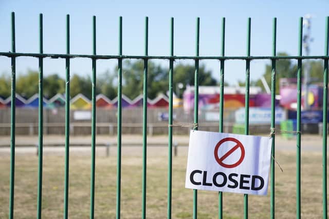 Closed signs on the gates of Liquid Leisure in Windsor