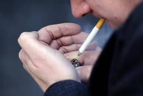 Litter enforcement officer said I had committed a crime as soon as the cigarette hit the floor