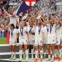 England's Ellen White and Jill Scott lift the trophy as England celebrate winning the UEFA Women's Euro 2022 final at Wembley Stadium, London. Picture date: Sunday July 31, 2022.