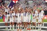 England's Ellen White and Jill Scott lift the trophy as England celebrate winning the UEFA Women's Euro 2022 final at Wembley Stadium, London. Picture date: Sunday July 31, 2022.