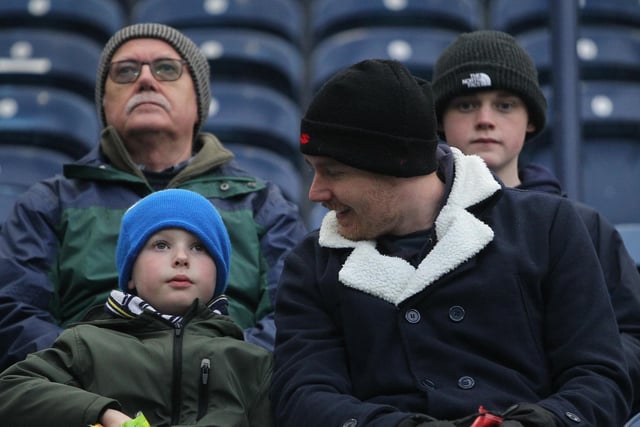 Four PNE wrap up in hats for the game against Blackpool