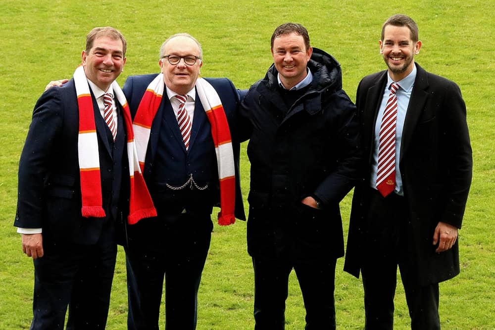 Morecambe co-chairmen Graham Howse and Rod Taylor, manager Derek Adams and director James Wakefield have all been waiting for a takeover to happen Picture: Michael Williamson