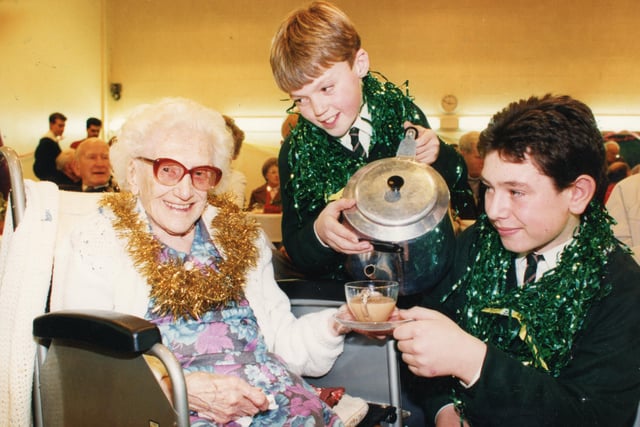 Old folks went back to school for a day for a special Christmas party thrown in their honour. Pupils and staff at Fulwood High School in Preston invited senior citizens to the school to help from celebrate Christmas. Andrew Cullen and Matthew Jackson are pictured serving 106-year-old Mary Sargeant
