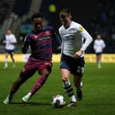 Preston North End's Ben Woodburn takes on Queens Park Rangers’ Ethan Laird