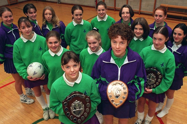 The under 16 and under 15 netball teams from All Hallows RC High School, Penwortham, who have won the South Ribble Championships. The under 16s also won the county round of the National Schools and will represent Lancashire at the North West round. Pictured: Team captains Catherine Barker (left) and Louise Charnock with their team mates