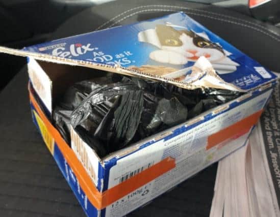 A 0.5kg block of pressed cocaine was found hidden in a cat food box in Steven Smith's car (Credit: Lancashire Police)
