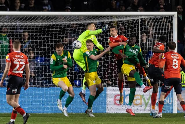 Preston North End goalkeeper Daniel Iversen attempts a punched clearance during the defeat to Luton Town at Kenilworth Road