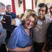Tory leadership hopeful and former Chancellor Rishi Sunak poses for a selfie with local party members in Clitheroe