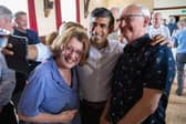 Tory leadership hopeful and former Chancellor Rishi Sunak poses for a selfie with local party members in Clitheroe