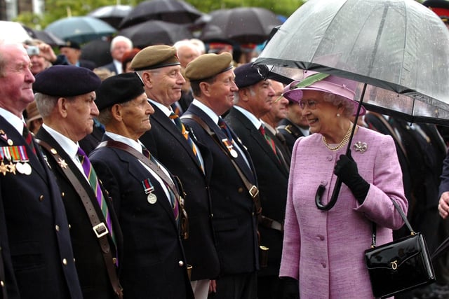The Queen meets dignitaries and veterans during a visit to Fulwood Barracks