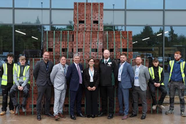 Persimmon Homes has donated 10,00 bricks to Preston College
Louise Doswell, Principal, Preston College, Kevin Farrington, Managing Director, Persimmon Homes Lancashire with four construction apprentices alongside representatives from Preston College and Persimmon Homes.