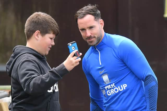 Greg Cunningham poses with a PNE fan at their pre-season friendly with Bamber Bridge.