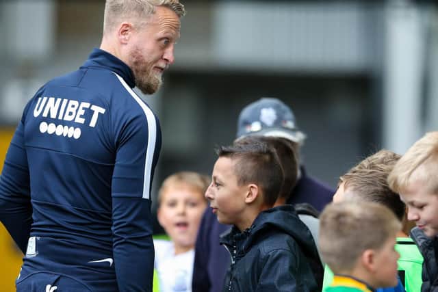 North End skipper Tom Clarke chats to some young PNE fans before the recent game against Bristol City