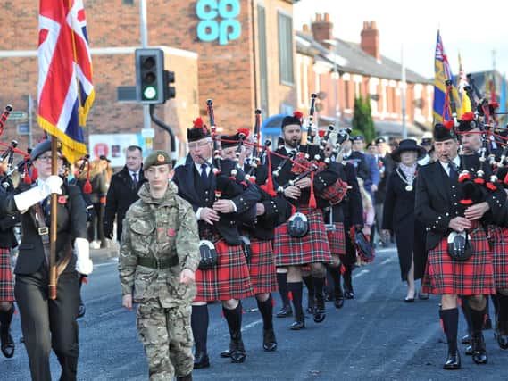 A band of pipers trumpeted Lostock Hall's Remembrance parade.