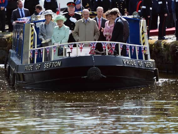 The Queen, Duke of Edinburgh and Prince of Wales (hidden right) on the Leeds and Liverpool canal in Burnley, 2012