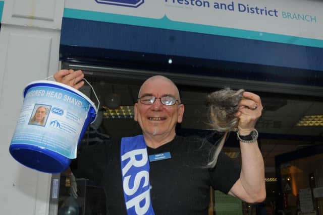 Peter Dalgleish, a volunteer at Preston and District RSCPA charity shop, Market Street, Chorley, after getting his long locks shaved off to raise funds for the charity.