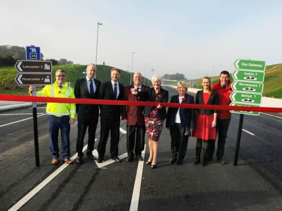 Celebrations at the opening of the Bay Gateway, the new M6 link road, Heysham, developed by Costain. Lancashire County Council leader Jennifer Mein (centre) with local delegates on the road before it opened to traffic.