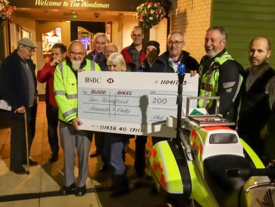 Lancashire Vehicle Club present a cheque to members of the North West Blood Bikes