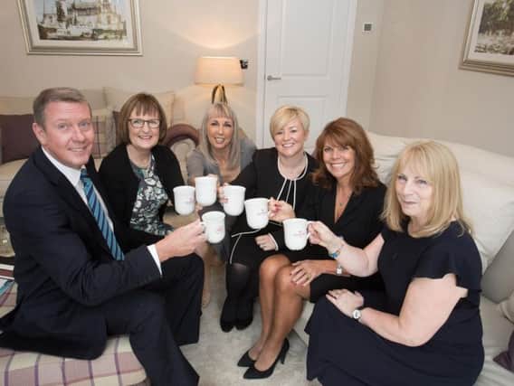 Derian House donation, from left, Redrow's Steve Greenhalgh, Julie Atherton, Susie Poppitt from Derian House, Redrow sales director Claire Jarvis, Georgina Cox and Kay Hepson