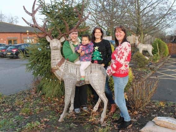 Jacob Fiddler with his mum Claire, staff of Rainbow House, and Prancer