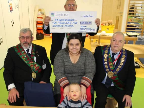 RAOB members Barry Skelhorn, Lenny Thompson and Robert Stewart-Hughes with Faye and Freddie Turner, who attend Rainbow House