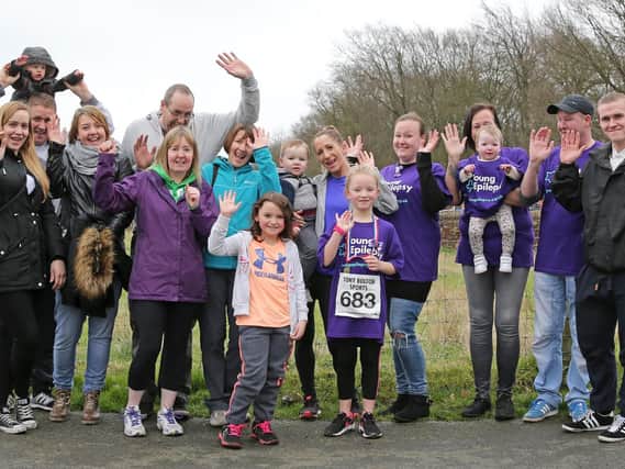 Holly Banks with her supporters during the 2.2k race at Abbey Village for Young Epilepsy