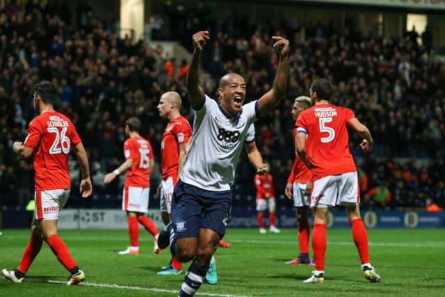 Alex Baptiste celebrates scoring against Huddersfield