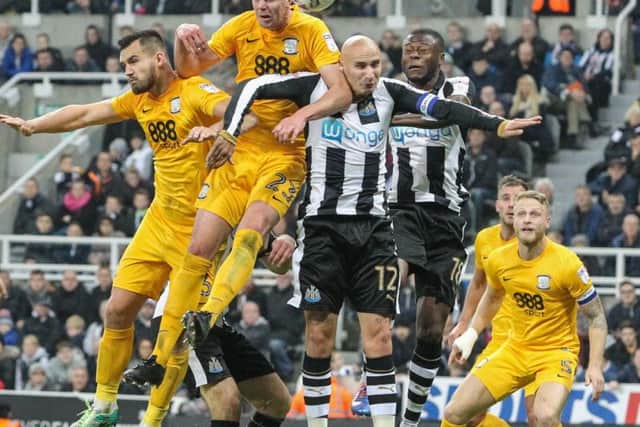 Newcastle midfielder Jonjo Shelvey challenges PNE defender Paul Huntington