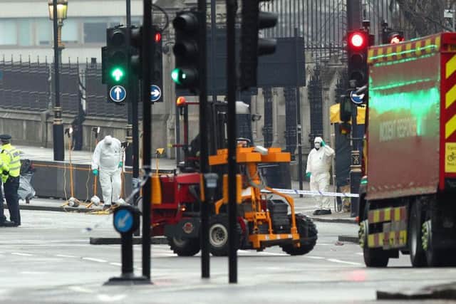 Forensics close to the Houses of Parliament in London the day after a terrorist attack where police officer Keith Palmer and three members of the public died and the attacker was shot dead