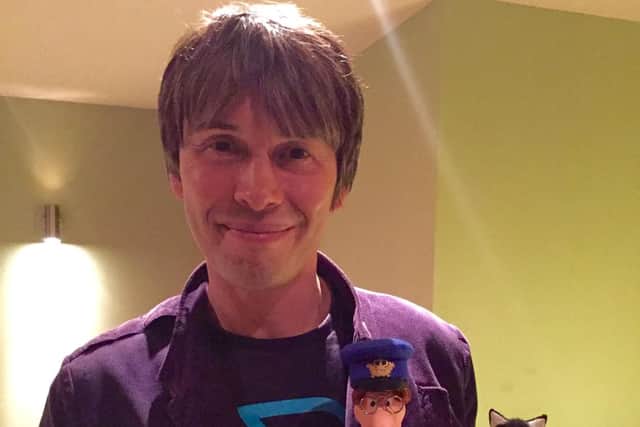 Brian Cox with models of Postman Pat and his cat Jess