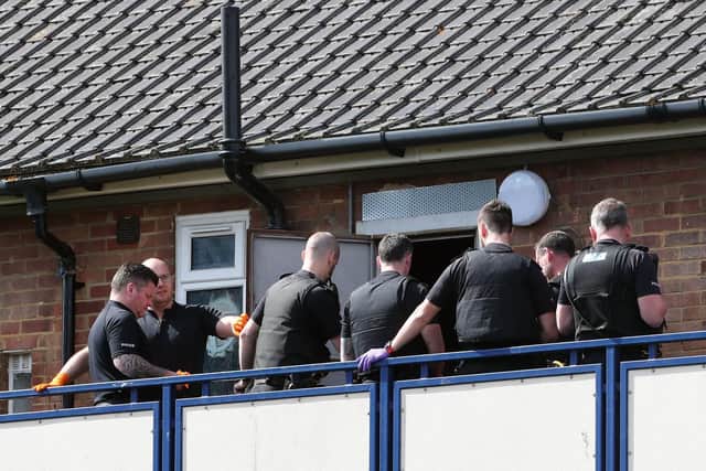 Police officers arrive to search a flat within Coronation Flats in Jenkins Dale, Chatham, in relation to a toddler attacked by a dog in a playground near the flats.