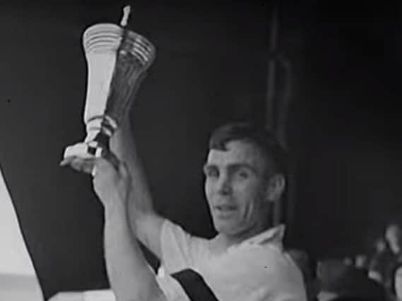 Preston North End captain Tom Smith lifting the wartime cup in 1941