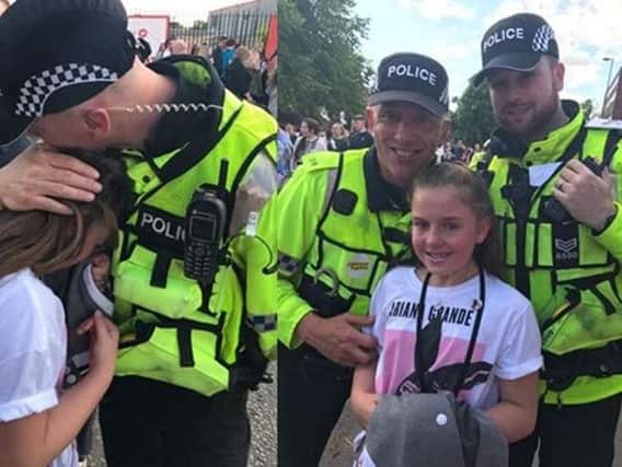 Preston police officers Sgt Luke Newman and PC Nick Cross (luminous vests) with 10 year old Poppy Sutcliffe at Manchester's One Love concert.