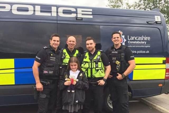 Preston police officers Sgt Luke Newman and PC Nick Cross (middle two) went to Durham to visit 10 year old Poppy Sutcliffe after helping her at Manchester's One Love concert.