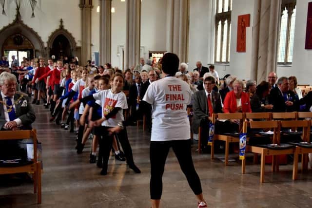 Children from St Barnabas Church of England Primary School, Darwen, Chatburn Church of England Primary School and SS Mary & Michael Catholic Primary School, Garstang, perform a dance routine at the Rotary Centenary Celebrations