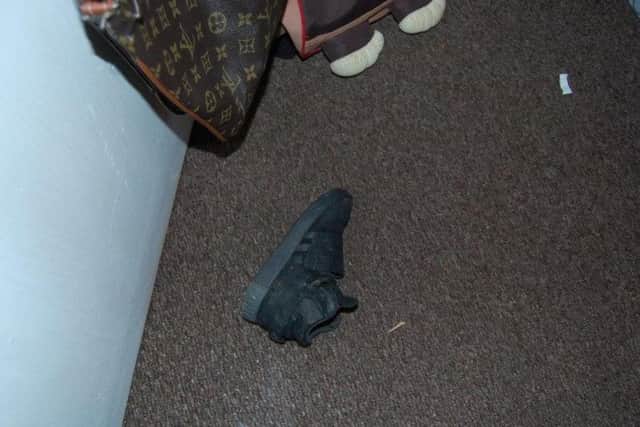 Undated Metropolitan Police handout file photo of one of Alex Malcolm's shoes at his home, as his stepfather Marvyn Iheanacho has been jailed at Woolwich Crown Court for life with a minimum term of 18 years after he battered his girlfriend's five-year-old son Alex to death in a park for losing a trainer